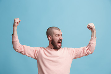 Image showing Winning success man happy ecstatic celebrating being a winner. Dynamic energetic image of male model