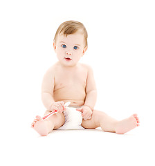 Image showing baby boy in diaper with toothbrush