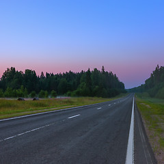 Image showing Empty Straight Asphalt Road At Dusk On A Misty Morning 
