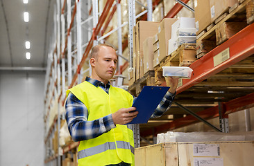 Image showing warehouse worker with clipboard and plastic box