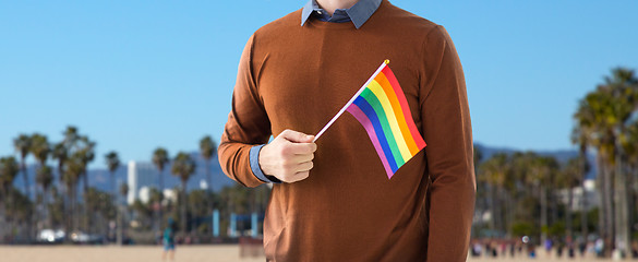 Image showing close up of man with gay pride rainbow flag