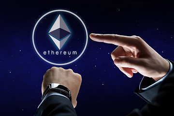 Image showing hands with smart watch and ethereum hologram