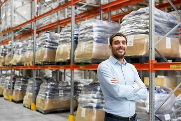 Image showing happy businessman at warehouse