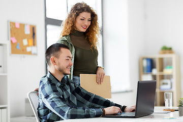 Image showing creative team with laptop working at office