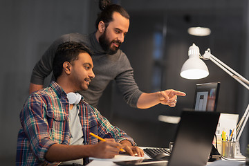 Image showing creative team with computer working late at office