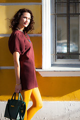 Image showing beautiful woman with a burgundy dress 