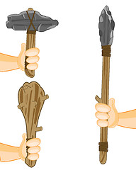 Image showing Spear with axe and bat of the stone age in hand of the person