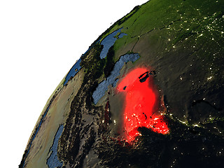 Image showing Uzbekistan in red on Earth at night