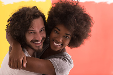 Image showing Young happy multiethnic couple hugging