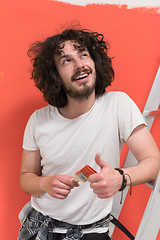 Image showing man with funny hair over color background with brush