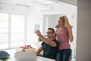 Image showing Young couple moving in a new home