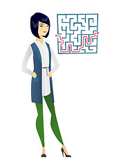 Image showing Business woman looking at labyrinth with solution