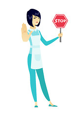 Image showing Asian cleaner holding stop road sign.