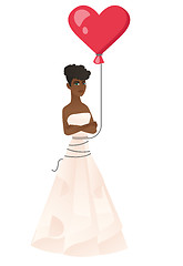 Image showing Serious bride with a heart-shaped red balloon.