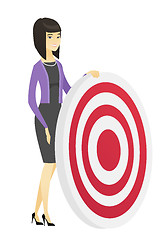 Image showing Young business woman and dart board.
