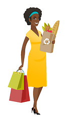 Image showing Pregnant woman holding paper bag full of food.