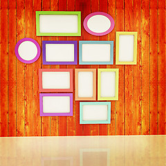 Image showing Mock up picture frames on wood wall. 3d illustration. Vintage st