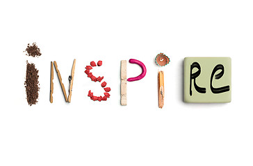 Image showing The word inspire created from office stationery.