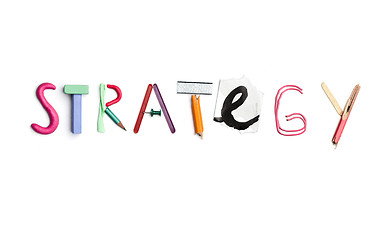 Image showing The word strategy created from office stationery.