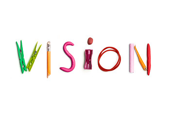 Image showing The word vision created from office stationery.