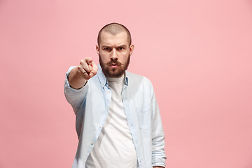 Image showing The overbearing businessman point you and want you, half length closeup portrait on pink background.