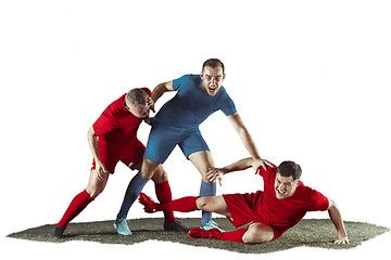 Image showing Football players tackling for the ball over white background