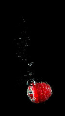 Image showing Fresh berry falling in water