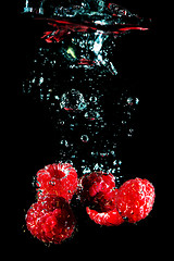 Image showing Fresh berry falling in water