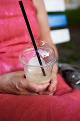 Image showing Adult woman using smartphone on bench