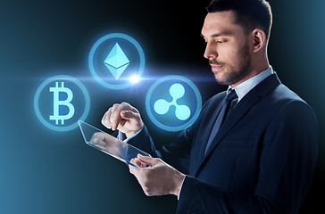 Image showing businessman with tablet pc and cryptocurrency