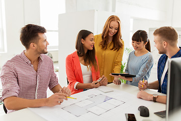 Image showing creative team with blueprint working at office