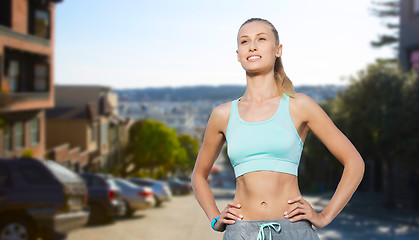 Image showing happy young woman doing sports outdoors