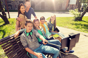 Image showing happy teenage students taking selfie by smartphone