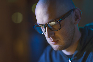 Image showing close up of bald hacker in glasses 