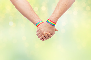 Image showing hands of couple with gay pride rainbow wristbands