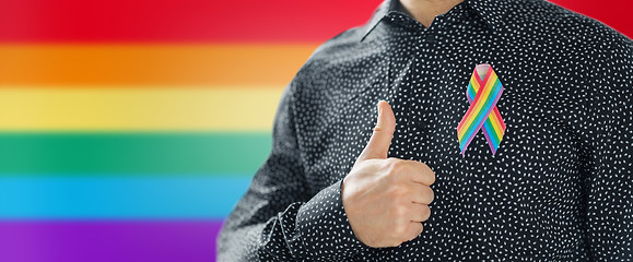 Image showing man with gay pride rainbow awareness ribbon