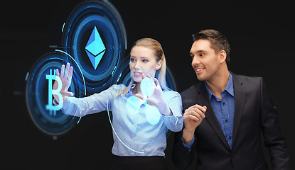 Image showing businesspeople with cryptocurrency holograms