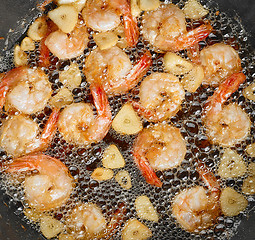 Image showing frying garlic prawns