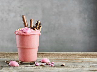 Image showing glass of pink milkshake