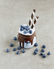 Image showing dessert of frozen banana, icecream and blueberries