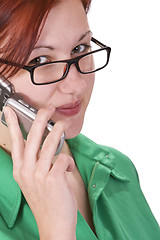Image showing Redheaded girl talking on a mobile phone