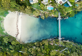 Image showing Pedestrian walking bridge over the long narrow bay