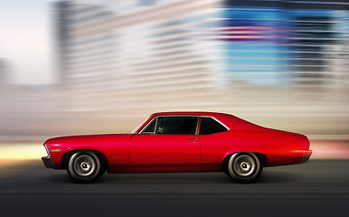 Image showing red retro car moving 