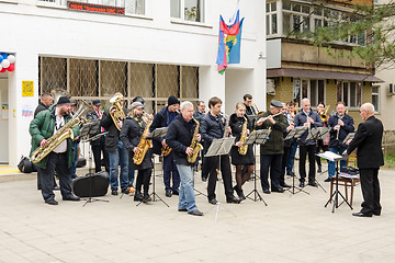 Image showing Anapa, Russia - March 18, 2018: Performance of the symphony orchestra in front of the library building in Anapa, at the presidential elections in Russia