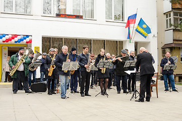 Image showing Anapa, Russia - March 18, 2018: Performance of the symphony orchestra in front of the library building in Anapa, at the presidential elections in Russia