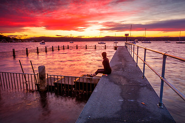 Image showing Watching the sunset from the jetty