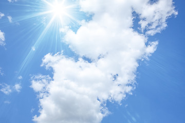 Image showing blue sky with bright sun and white clouds