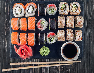 Image showing Various sushi rolls on slate