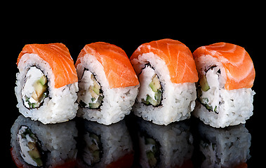 Image showing Sushi roll Philadelphia in row rotated