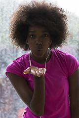 Image showing portrait of young afro american woman in gym while listening mus